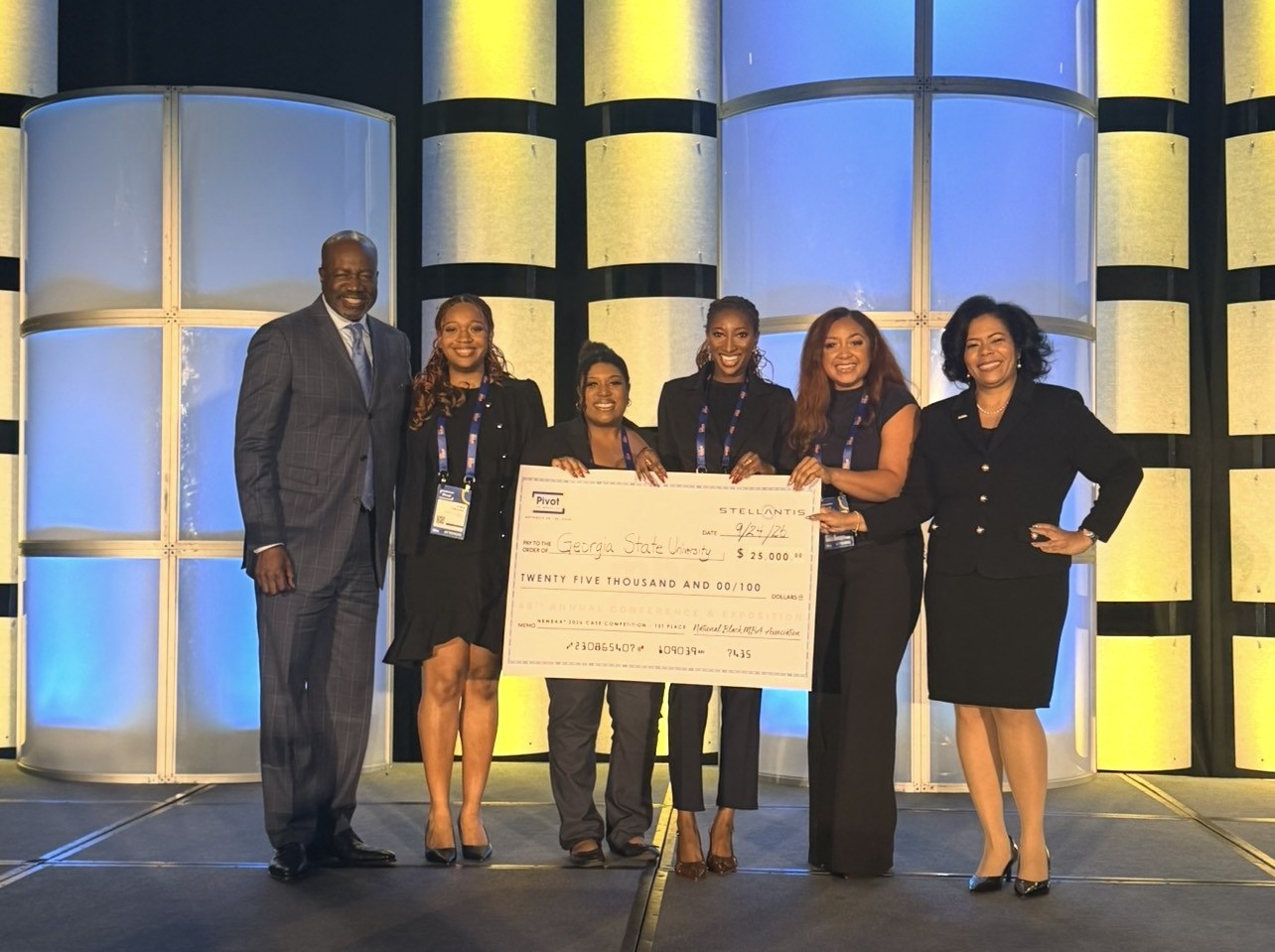 Tierra's team accepting first place at the NBMBAA case competition